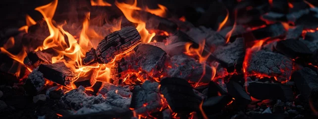 Foto op Plexiglas Burning firewood and coals of a fire close up. Background for grilled food with fire. © petrrgoskov