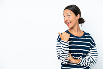 Young hispanic woman isolated on white background pointing to the side to present a product