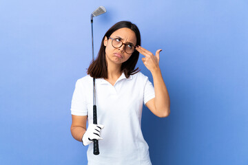 Young golfer woman over isolated colorful background with problems making suicide gesture