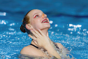 Serene beauty of solo synchronized swimming, a captivating display of aquatic grace and precision