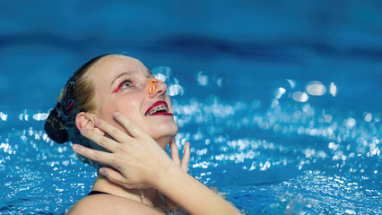 Serene beauty of solo synchronized swimming, a captivating display of aquatic grace and precision