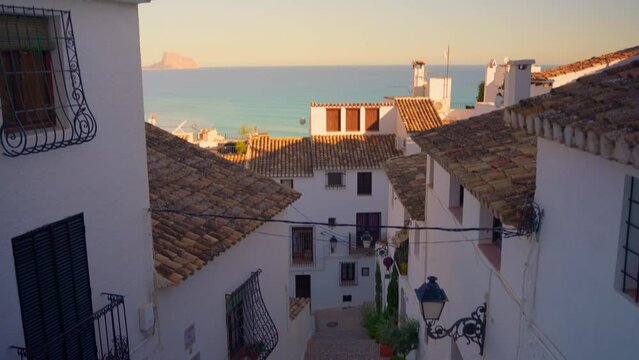 Altea is a little sea village city with white houses in Mediterranean coast called the Costa Blanca, Spain. Spanish city of Altea in the city center on the mountain church with a blue roof
