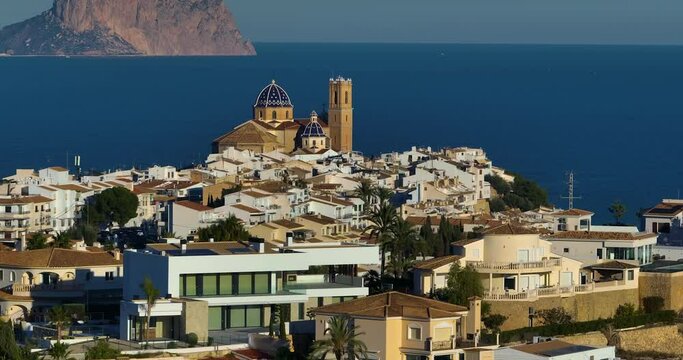 Spanish city of Altea in the city center on the mountain church with a blue roof. Aerial view of the city of Altea and the picturesque Mediterranean coast. Spain