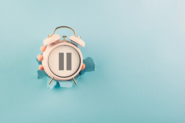 Alarm clock with pause sign, take a break, menopause concept, hormone replacement therapy - obrazy, fototapety, plakaty