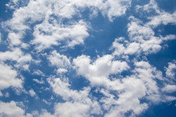 Obraz premium White clouds drift in a blue African sky above the South African Highveld