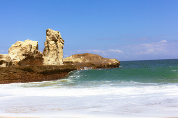 Beautiful beach with waves breaking on the rocks, Pacitan Klayer, East Java, Indonesia