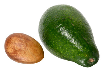 Whole green avocado fruit and pit isolated on white background