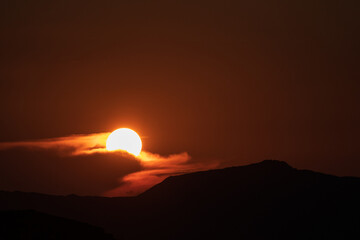Sunset's glow ignites tranquility.
