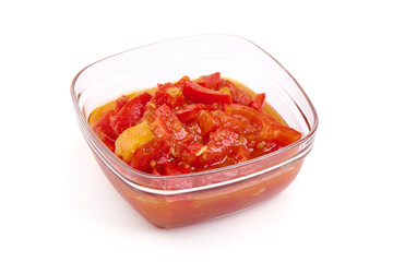 Hungarian lecho of tomatoes and sweet paprika, isolated on white background.