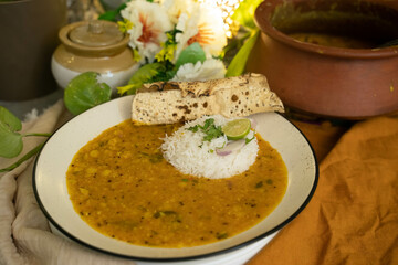 Indian popular food Dal fry or traditional Dal Tadka Curry or yellow lentil curry served with...