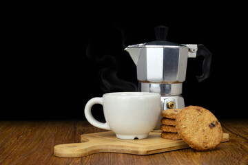 Coffee and cookies and mokapot on tray on wooden table. Copyspace for your text