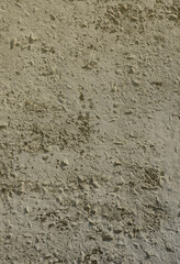 Texture of the old embossed concrete wall in gray color. Background image of a concrete product