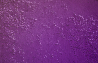 Texture of a metal wall with an old paint coating that spoils under the influence of time and weather