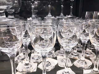 Shot glasses on the shelf ,For Alcohol Tableware Stacks Clear Glass ,Stand On Shelf In Supermarket. Concept Bar Tableware Party