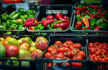 Organic fresh different tomatoes from mediterranean farmers market. Healthy local food market. Variety of tomatoes: green, red, yellow, black. Market in Gordes, Provence, France.