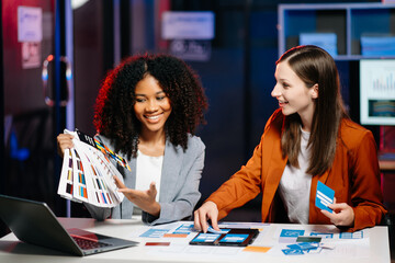  UX developer and ui designer brainstorming about mobile app interface wireframe design with...