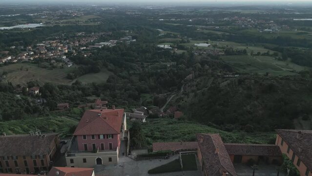 Aerial view of italian countryside from the little village of Montevecchia, Italy. Stunning architecture and beautiful forests around. 4K drone shot.