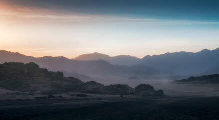 peaks of mountains in the desert of egypt against sunset