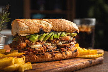 Traditional Peruvian sandwich of roast beef in its juice with avocado and white onion, served on...