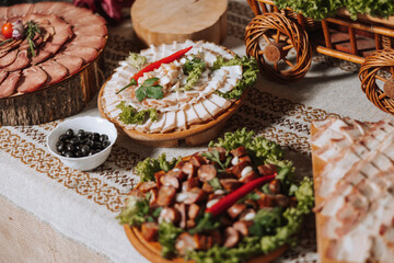 Cossack table. Banquet hall Meat treats for guests. Homemade cutouts. Pork tenderloin. Delicious meat cuts. Meat plate. Delicious compositions from smoked mint. Cottage cheese.