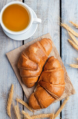 Close-up of croissants on a dark background. Fresh and delicious French pastries, bakery concept, close-up image. tea .