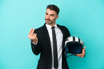 Business caucasian man with motorbike helmet isolated on blue background making money gesture