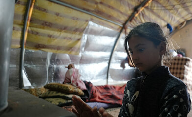World Refugee Day. Syrian refugee children suffer from tragic humanitarian conditions in winter. 
