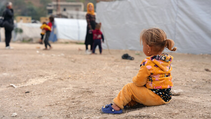 World Refugee Day. Syrian refugee children suffer from tragic humanitarian conditions in winter. 