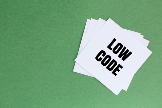 white paper with the words low code. technology concept