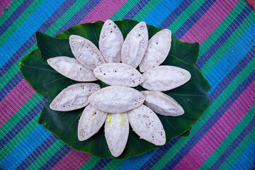 Bangladeshi Traditional Aush or Porangi Rice Special  Delicious hand-made Chitoi Pitha Decorated on the green leaf Recipe