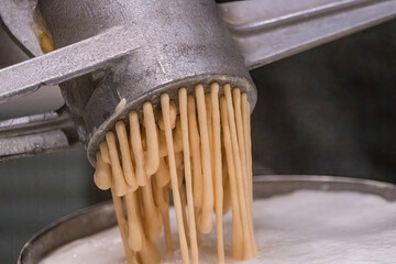 Preparation of Spätzle - Spaetzle, a Swabian type of noodle, preparation of food.