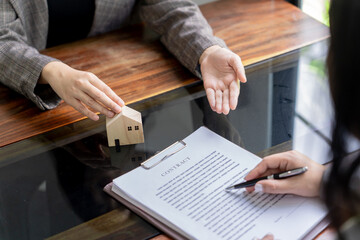 Business people signing contract making deal with real estate agent Concept for consultant home...