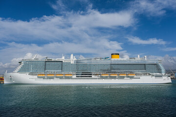 Mega modern LNG green eco cruiseship or cruise ship liner Toscana in port