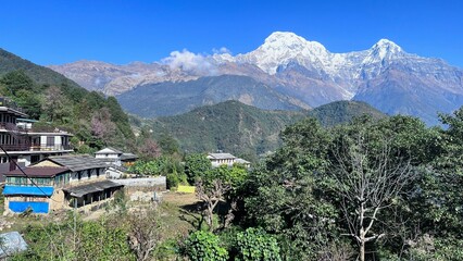 Annapurna snow mountain range in Nepal at day time with the village of 