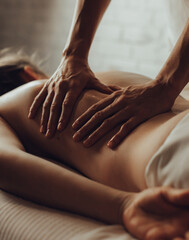 Hands of female chiropractor massaging shoulders of young woman lying on massage table. Concept of physical therapy treatment ,neck pressure point - 698667150