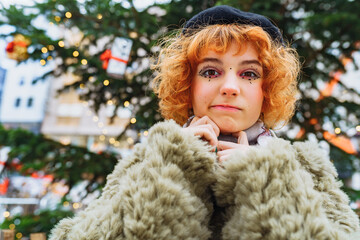 Portrait attractive young woman with festive makeup against background Christmas decor