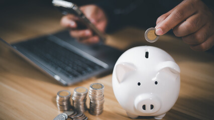 Businessman and piggy bank, planning concept for saving money for family, depositing money, shopping, buying, selling, traveling. Loan, Financial, save money, and business.