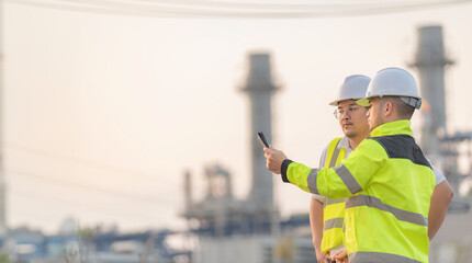 Group Asian man petrochemical engineer working at oil and gas refinery plant industry factory,The...