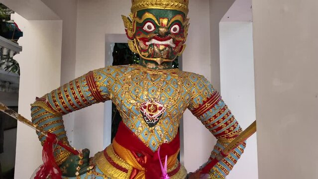 Buddhist guardian statue in Wat Phra That Doi Kham temple near Chiang Mai.