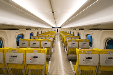 NAGASAKI, JAPAN - DEC 15, 2023: Interior of N700S series Nishi Kyushu Shinkansen Kamome train ordinary car with comfortable seats and modern Japanese style design