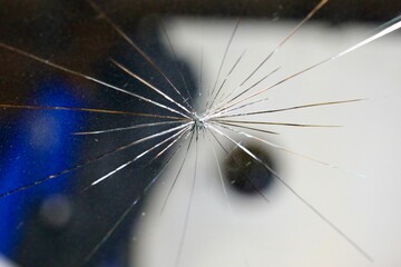 broken windshield of the car from flying stone