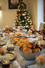 Christmas familiy dinner table with Christmas tree decorations 