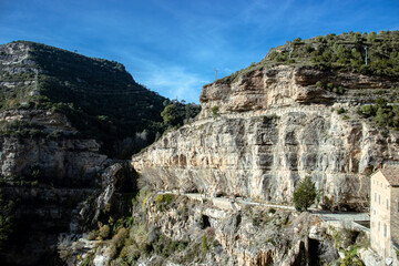 Fototapeta na wymiar Sant Miquel del Fai is an 11th-century Benedictine monastery. Cliffs building formation, Catalonia.