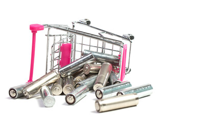 Batteries in a shopping cart on a white background