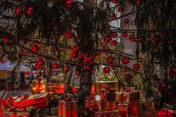 Winter holidays in Italy. Beautiful New Year tree with gifts in the center of Bergamo, Italy