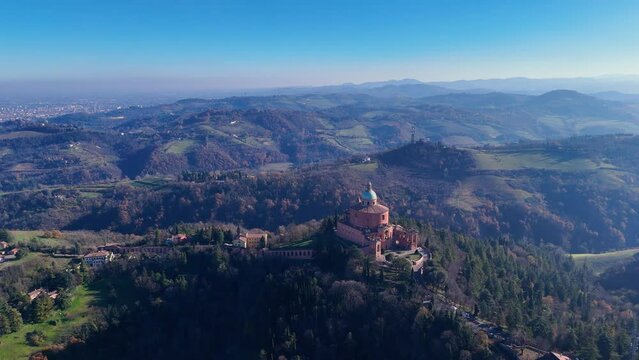 Aerial 4k view with daylight of Madonna di San Luca basilica located on the hills of Bologna city Italy
