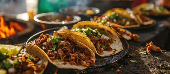 Fotobehang In northern Mexico, roast meat tacos with Chorizo are a popular dish that is cooked by exposing food to heat from embers, known as Carne Asada, Asado, Discada, or Parrillada. © AkuAku