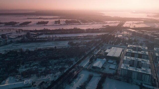 sunny winter over arctic town, sunset and snow at european city suburb residential district, snowfall at europe 4k