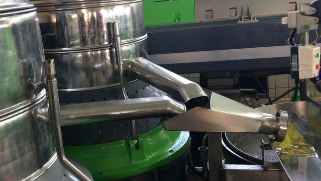 Zoom Out Producing Olive Oil From Fresh Olives In The Factory
