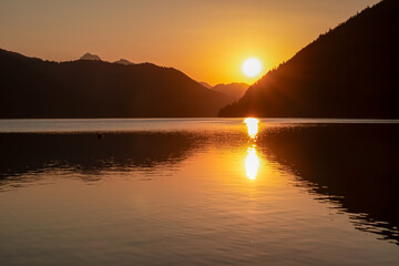 Breathtaking allure of sunset at alpine lake Weissensee in remote Austrian Alps in Carinthia....
